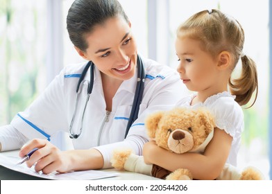 Doctor Examining A Child In A Hospital