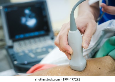 Doctor is examining heart's patient by echocardiogram for diagnosis disease or explain symptom. Medical exam , ultrasound. Medical equipment.