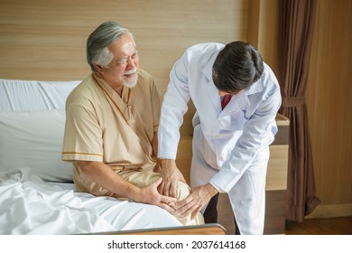 doctor examining the knee and leg  after surgery of asian senior old man patient suffering from pain in knee on bed in medical office room at hospital . diversity  people  