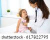 doctor examining child