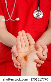 Doctor Examining Nerve Conduction On Palm Of Hand After Carpal Tunnel Syndrome