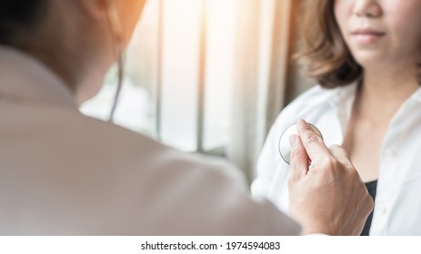 Doctor Examining Patient Health On Coronary Artery Disease, Blood Vessel Or Congenital Heart Defect, Heart Rhythm Problem, Arrhythmias, Cardiovascular Illness In Medical Clinic By Checking Heartbeat