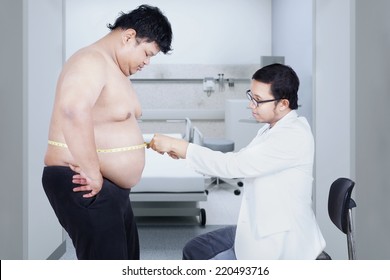 Doctor examining a patient obesity, shot in hospital