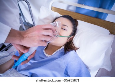 Doctor Examining A Patient On Bed In Hospital