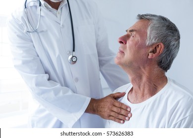 Doctor Examining A Senior Man In Clinic