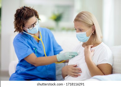 Doctor examining sick patient in face mask. Ill woman in health clinic for test and screening. Home treatment of virus. Coronavirus pandemic. Covid-19 outbreak. Woman coughing, having chest pain.