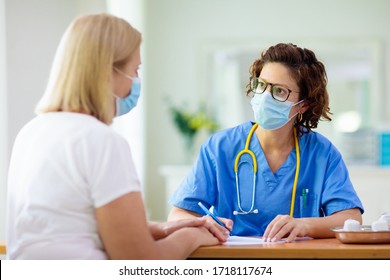 Doctor Examining Sick Patient In Face Mask. Ill Woman In Health Clinic For Test And Screening. Home Treatment Of Virus. Coronavirus Pandemic. Covid-19 Outbreak. Woman Coughing, Having Chest Pain.