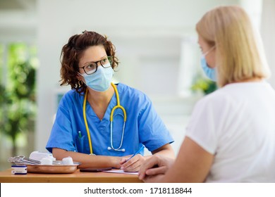 Doctor Examining Sick Patient In Face Mask. Ill Woman In Health Clinic For Test And Screening. Home Treatment Of Virus. Coronavirus Pandemic. Covid-19 Outbreak. Woman Coughing, Having Chest Pain.