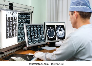 Doctor examining x-ray images in hospital