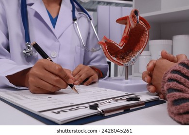 The doctor explained gastritis using a model. Treatment options were discussed. Understanding the condition better helps in managing it effectively.