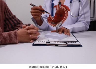 The doctor explained gastritis using a model. Treatment options were discussed. Understanding the condition better helps in managing it effectively.