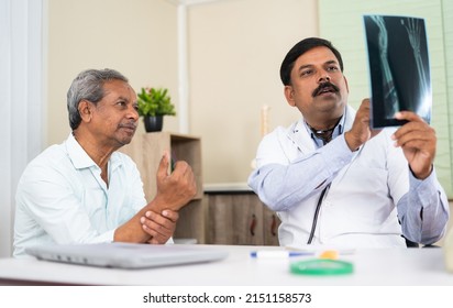 doctor explaining by seeing x-ray report to senior elderly patient at hospital - concep tof medical treatment, assistance and Healthcare - Powered by Shutterstock