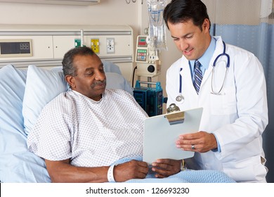 Doctor Explaining Consent Form To Senior Patient