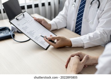 The doctor is explaining the details of the patient's physical examination. The concept of annual physical examination for healthy health care and timely disease detection and treatment. - Shutterstock ID 2022895805