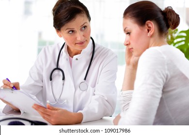 Doctor Explaining Diagnosis To Her Female Patient