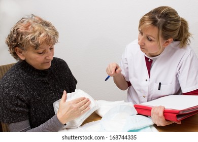 Doctor explaining something to a pensioner