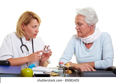 Doctor Explaining Usage Of Medication To Senior Woman