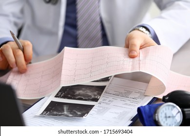 Doctor explains cardiogram data, consultation. Repeated consultation, doctor develops an optimal treatment regimen, explains how to properly control state health. Prevention, treatment heart disease.