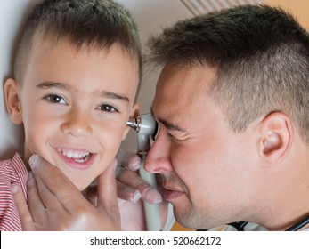 Doctor Explores The Ear To Child Close Up