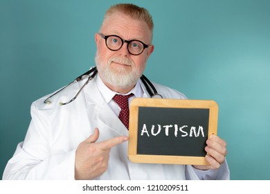 Doctor With Eyeglasses Holding Chalkboard With Lettering Autism On Blue Background