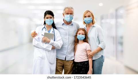 Doctor and family wear face mask in hospital protect from COVID-19. People health care and medicine concept.