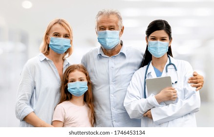 Doctor and family wear face mask in hospital protect from COVID-19. People health care and medicine concept. - Powered by Shutterstock