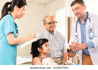 Doctor And Family Wear Face Mask In Hospital Protect From COVID-19. People Health Care And Medicine Concept.