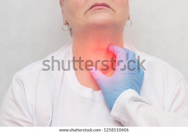 Doctor feels the thyroid gland in\
a patient of an adult woman, thyroid cancer, close-up,\
node