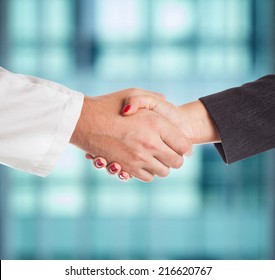 Doctor And Female Patient Handshake
