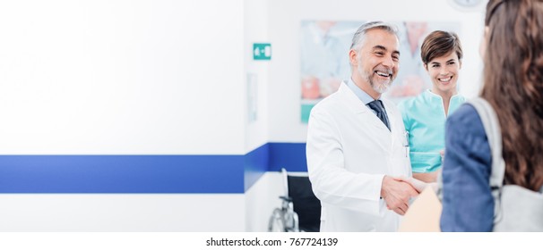 Doctor And Female Patient Meeting At The Hospital And Shaking Hands, Healthcare And Medicine Banner