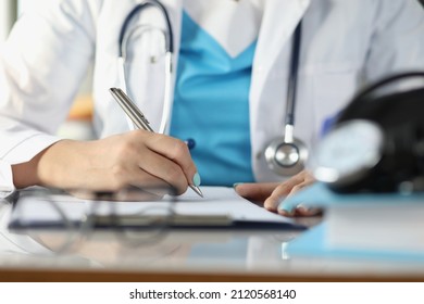 Doctor fill patient illness history or prescribe medication for client, busy doctor