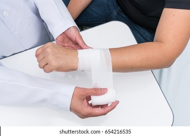 Doctor First Aid Patient Wrist Sprain.