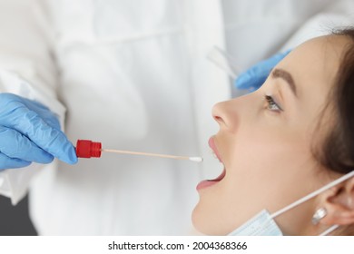 Doctor In Front Of Biological Material Of Saliva From Patient For Diagnosis Of Covid