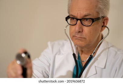 Doctor Getting Ready To Check Hear Beat With Stethoscope Focus On Face