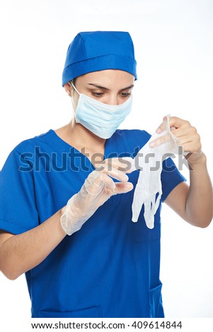 doctor getting ready for operation isolated on white