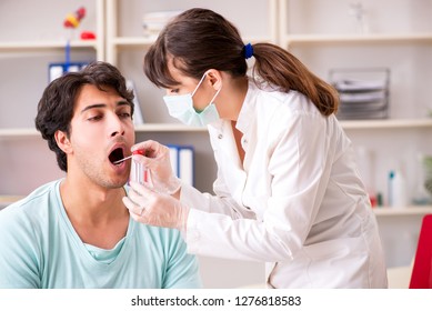 Doctor Getting Saliva Test Sample In Clinic Hospital