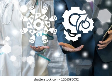 Doctor Gives A Doctor Working Group Logo And Businessman Represents A Gear Mechanism Icon On A Virtual Interface. Meeting, Quality Cooperation, Teamwork, Healthcare Business Collaboration. Conference.