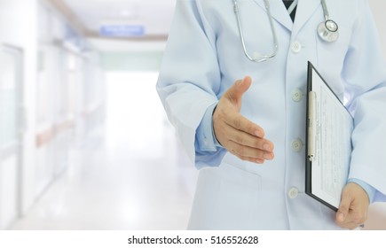 Doctor Giving Him Hand For Handshake To Patient For Greetings And Recommends. Doctors At Hospital.