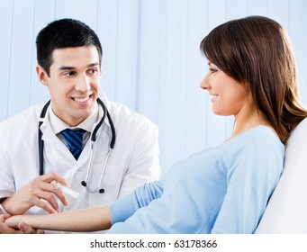 Doctor Giving An Injection To Female Patient