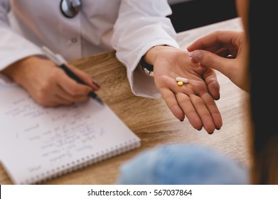 Doctor Giving Medicine To Patient