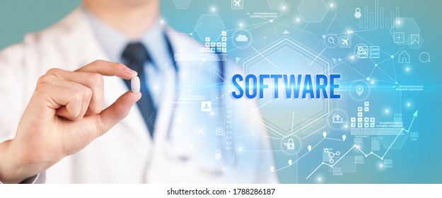 Doctor Giving A Pill With SOFTWARE Inscription, New Technology Solution Concept