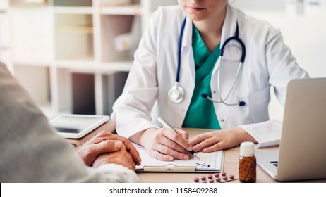 Doctor giving prescription to patient - Powered by Shutterstock