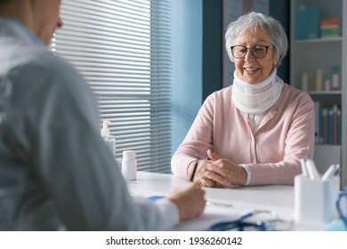 Doctor giving a prescription to a senior patient with cervical collar