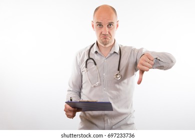Doctor giving a thumbs down gesture as he holds a patients records to show and bad prognosis or death