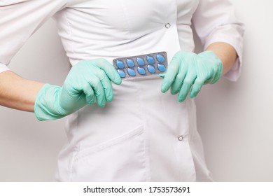 Doctor In Gloves Holds Pills For Men's Sexual Health