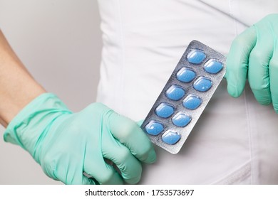 Doctor In Gloves Holds Pills For Men's Sexual Health