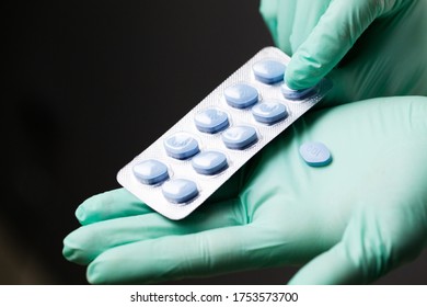 Doctor In Gloves Holds Pills For Men's Sexual Health