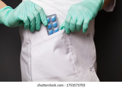 Doctor In Gloves Holds Pills For Men's Sexual Health