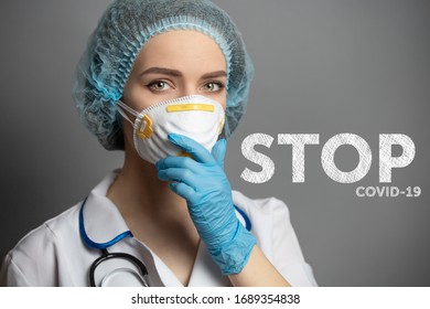 doctor with gloves on a mask and in a dressing gown the concept of the fight against coronavirus covid 19.