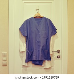 Doctor Gown On A Hanger On The Closed Door Of The Home Room